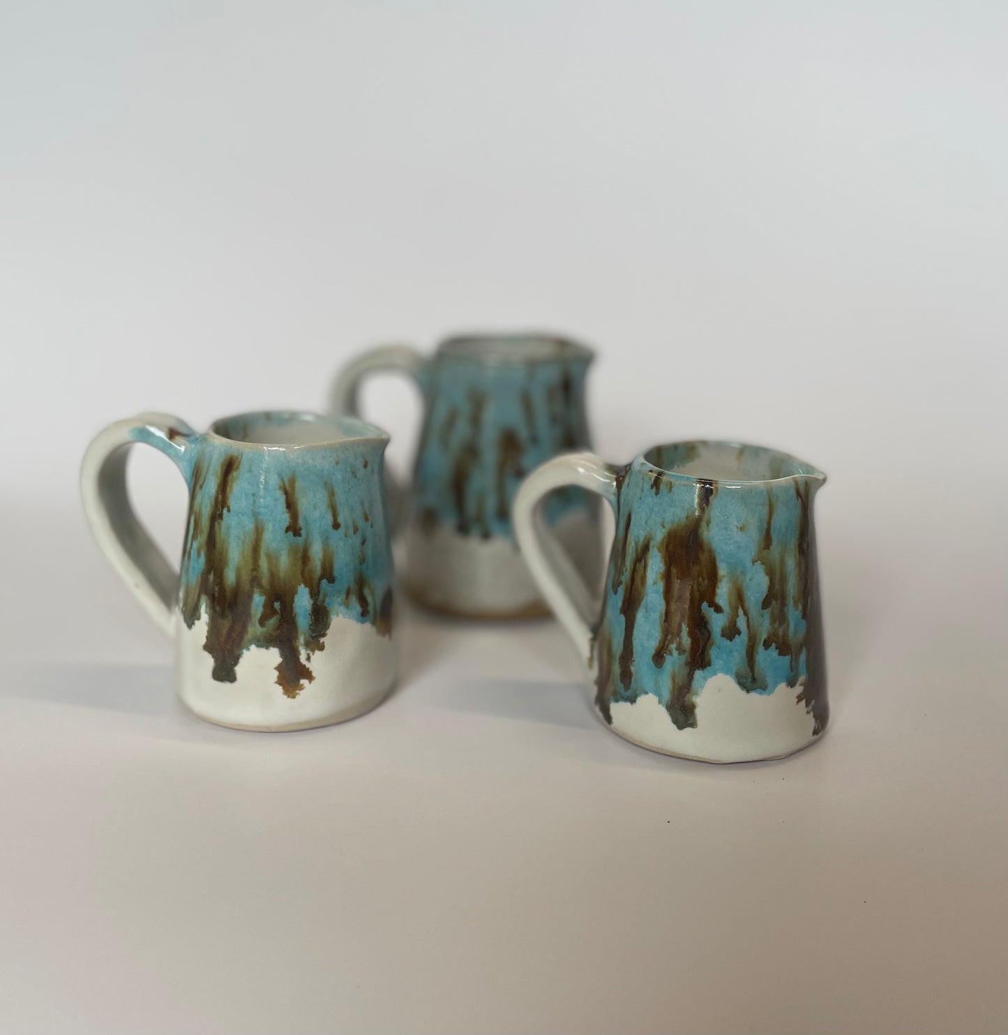 Blue jug with brown speckles