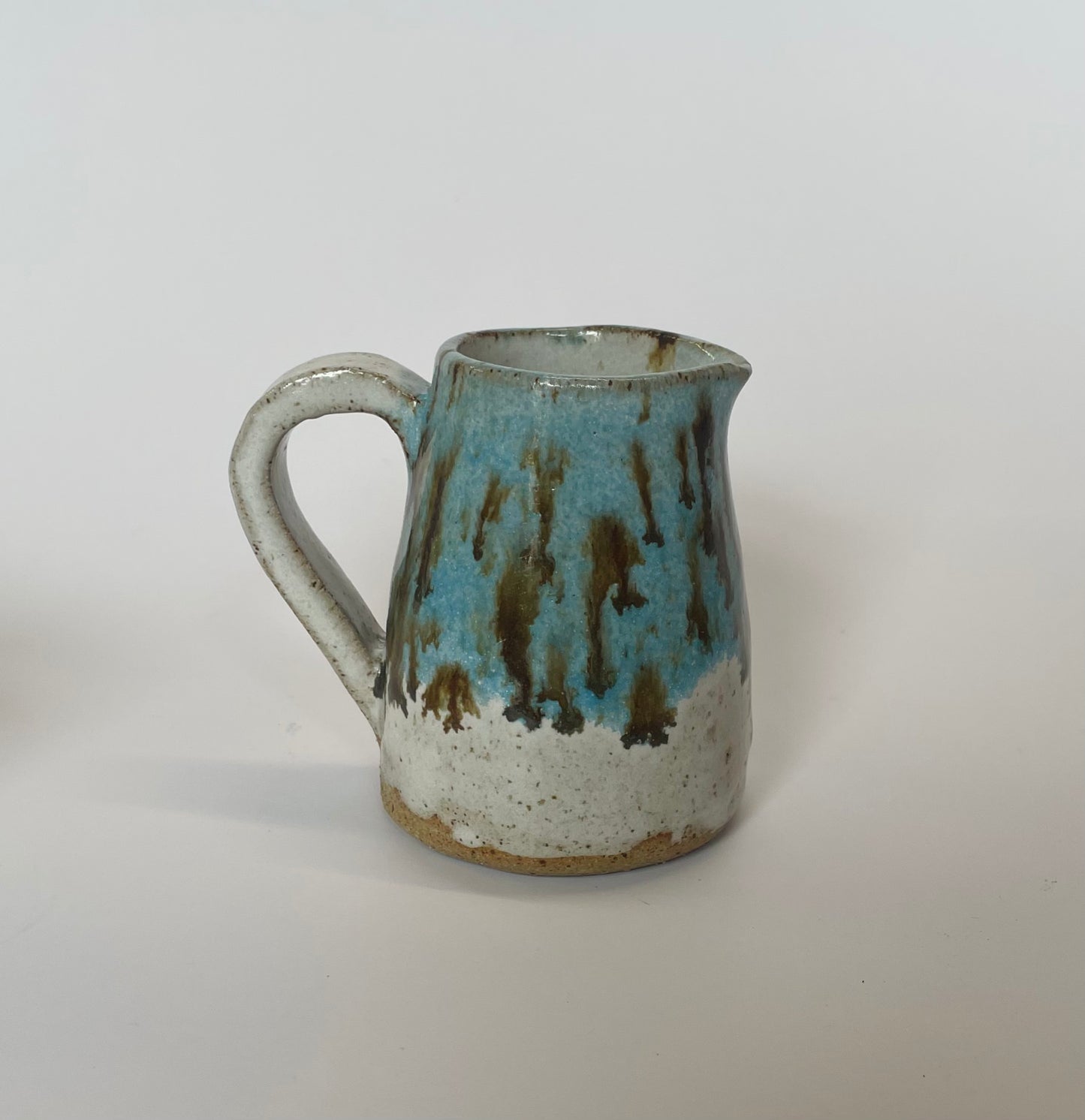 Blue jug with brown speckles