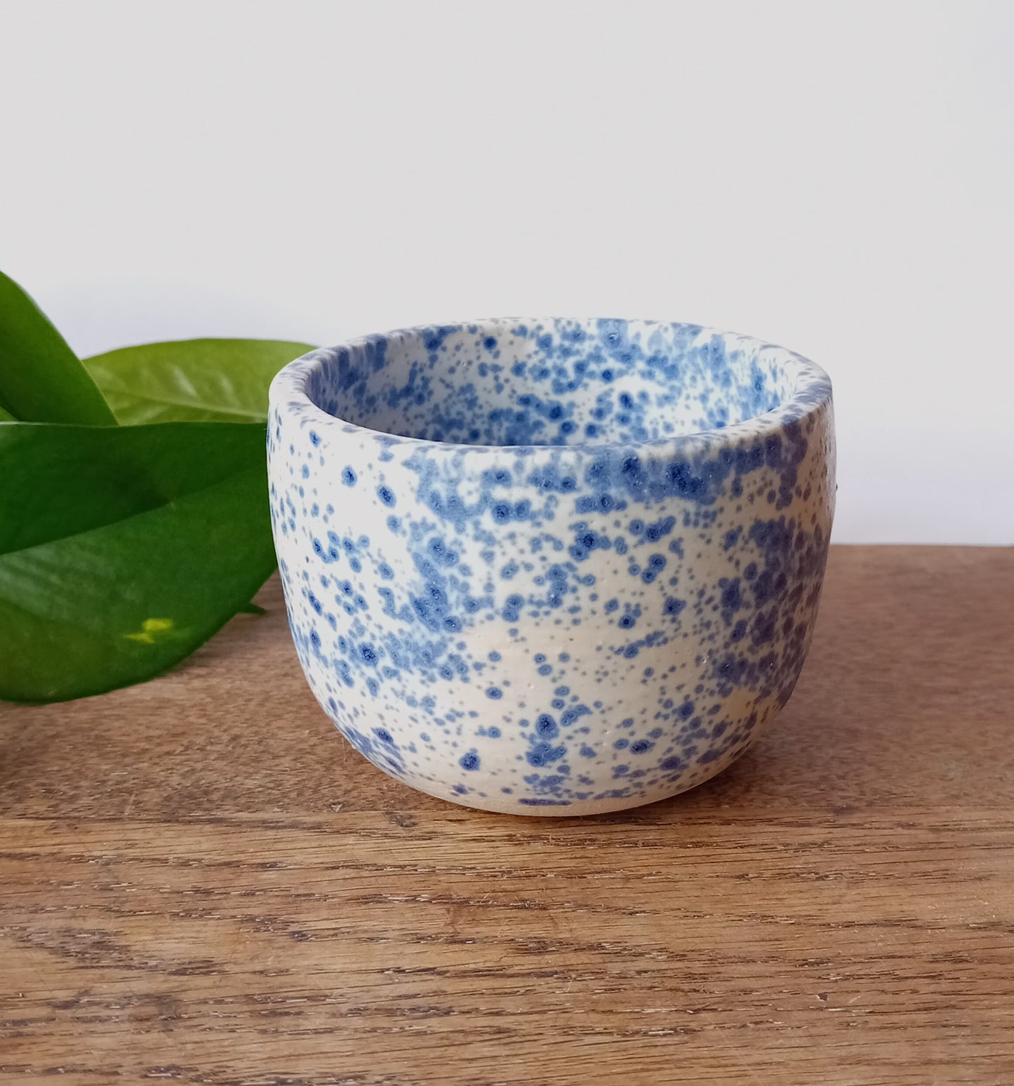 Handthrown tumbler with white and blue speckle glaze