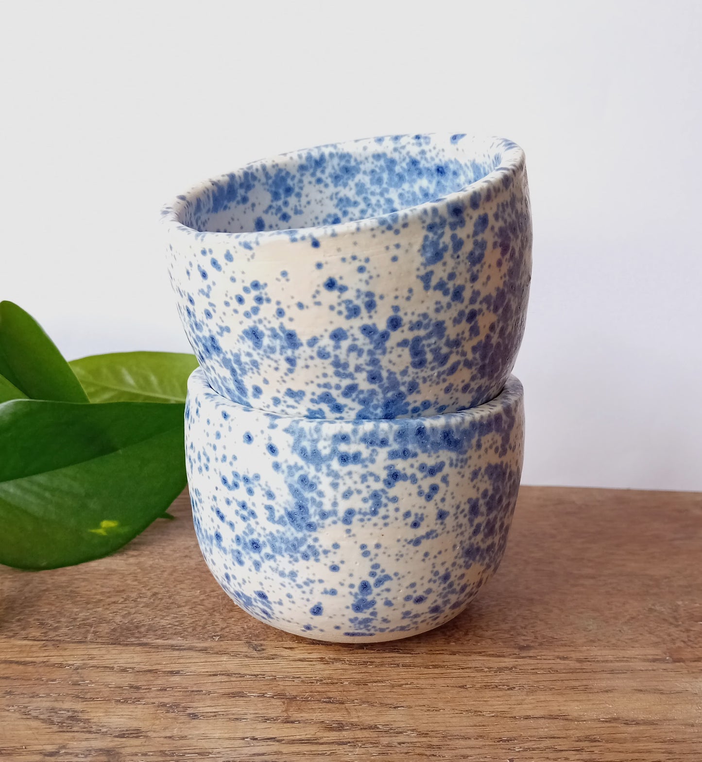 Handthrown tumbler with white and blue speckle glaze