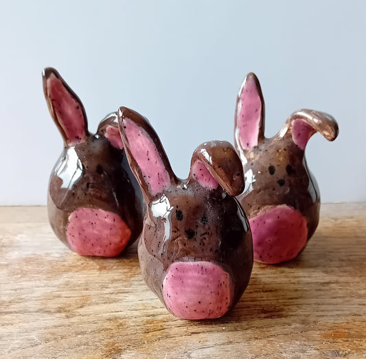 Ceramic bunny figures brown and pink