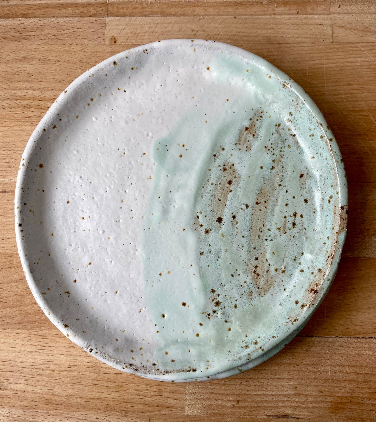 White and green speckled side plates