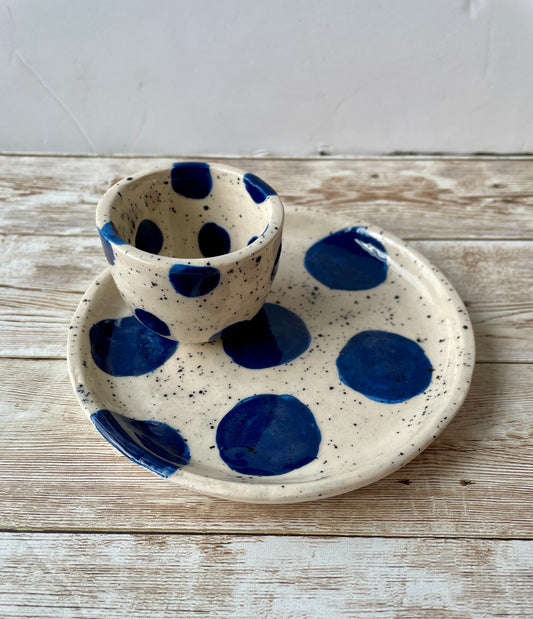 Egg cup and saucer with dark blue spots