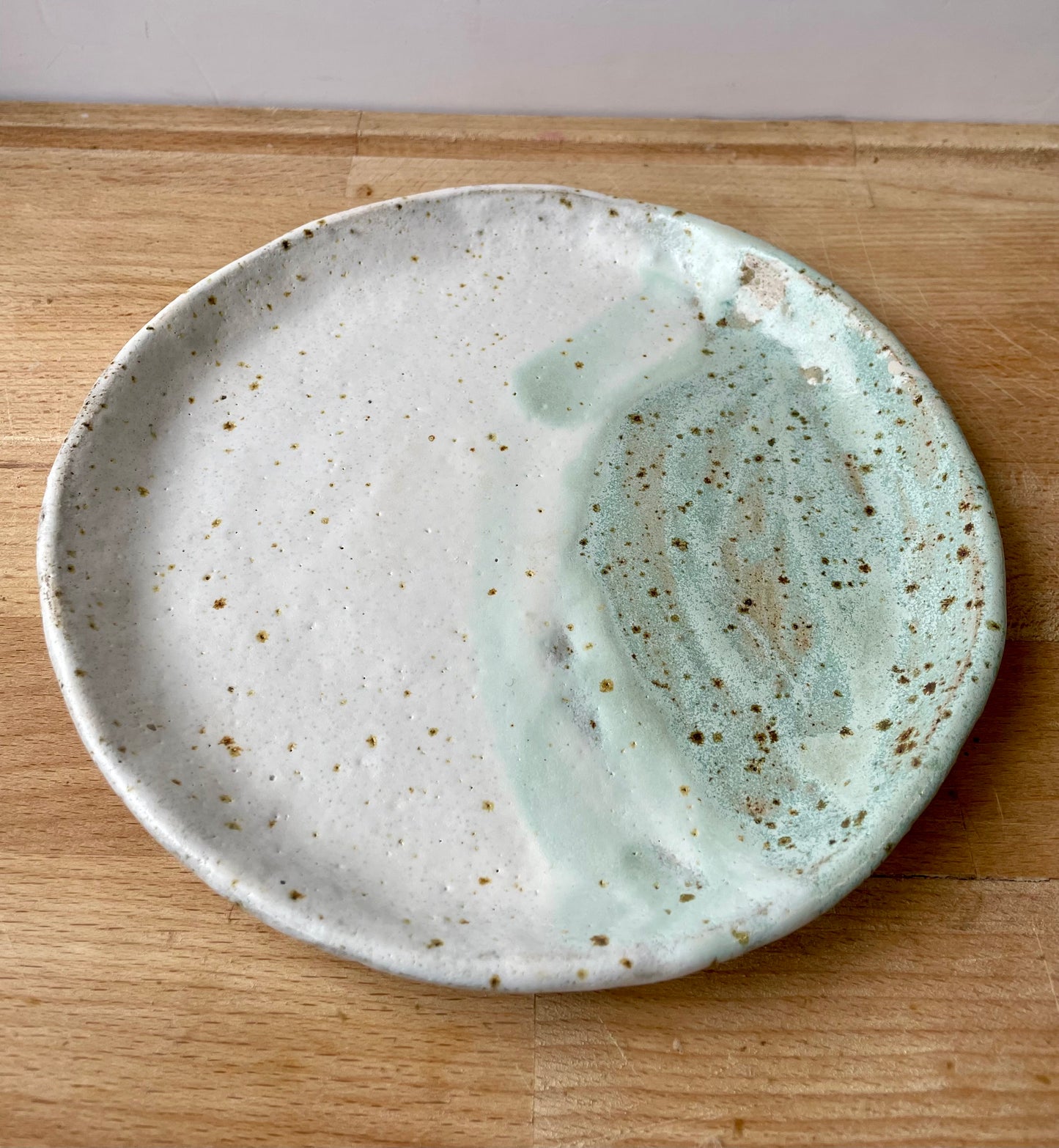 White and green speckled side plates