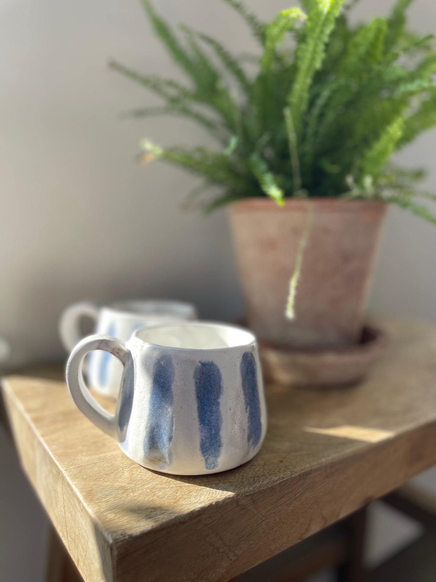 Blue and white striped mug