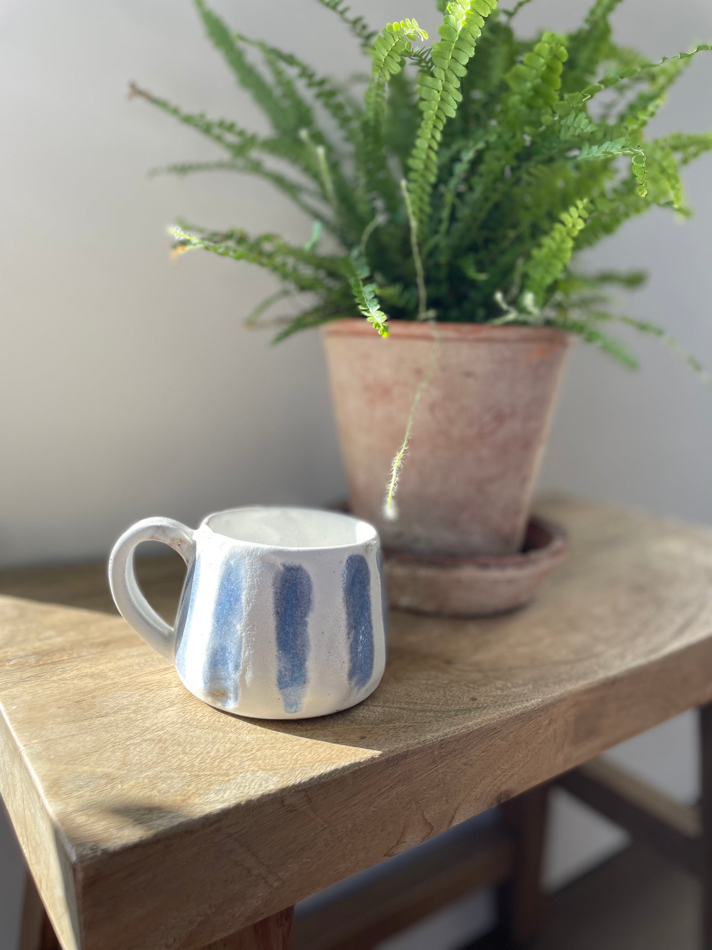 Blue and white striped mug