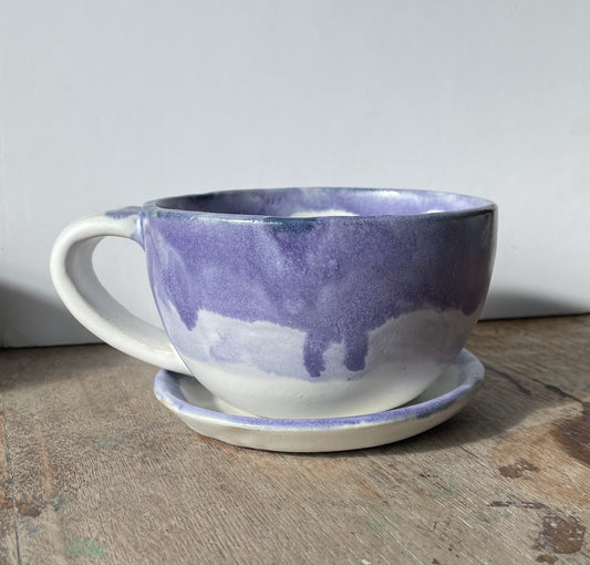 Cup and saucer with purple and white glaze