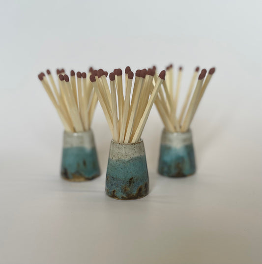 Match striker pots