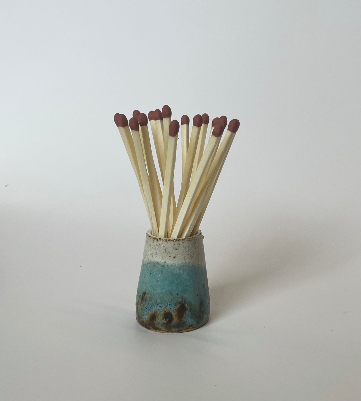 Match striker pots
