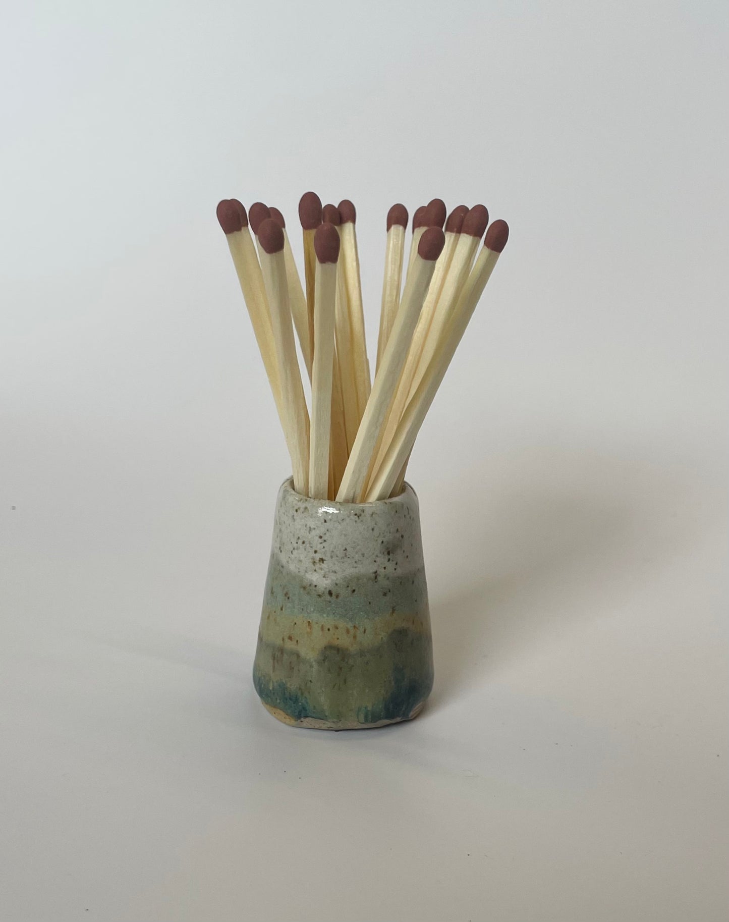 Match striker pots