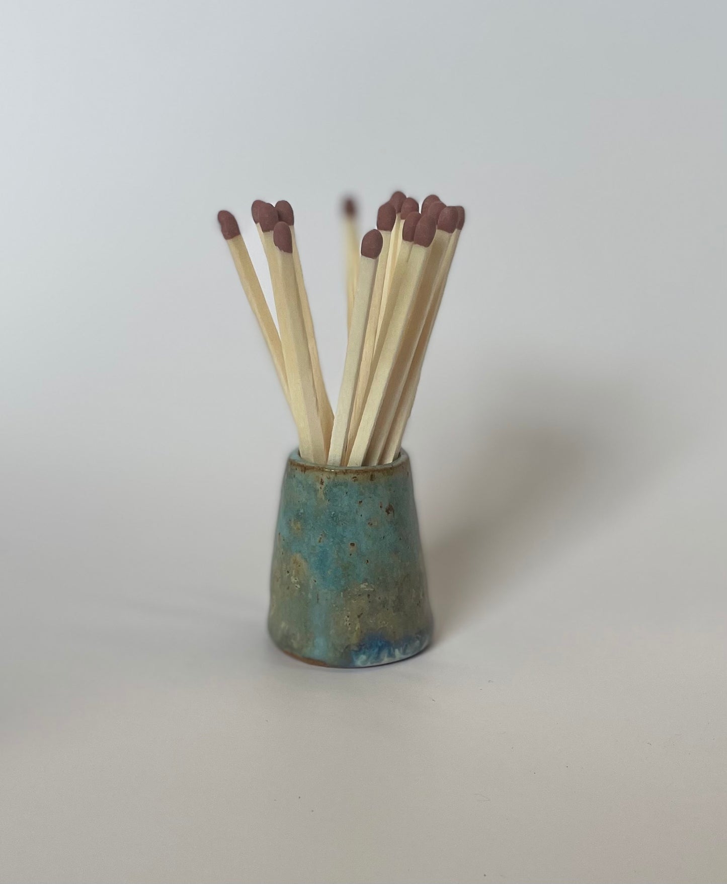 Match striker pots